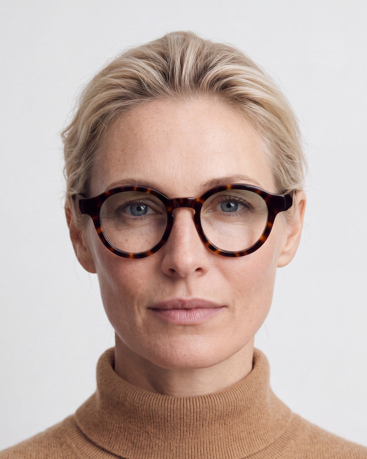 Nora in tortoiseshell, worn, Sage lenses
